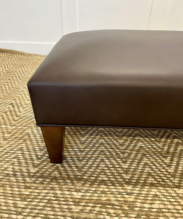 Delcor-bespoke-luxury-footstool-meticulously handcrafted in Britain-choose from over 10,000 fabrics-including velvets-leathers-vast array of patterned and plain materials-available in a broad spectrum of colours-including grey-cream-blue-purple-red-green-and more-each piece showcases timeless design and comfort.