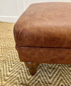 Delcor-bespoke-luxury-footstool-meticulously handcrafted in Britain-choose from over 10,000 fabrics-including velvets-leathers-vast array of patterned and plain materials-available in a broad spectrum of colours-including grey-cream-blue-purple-red-green-and more-each piece showcases timeless design and comfort.